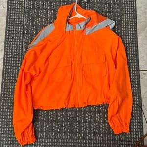 Orange cropped wind breaker true to size
